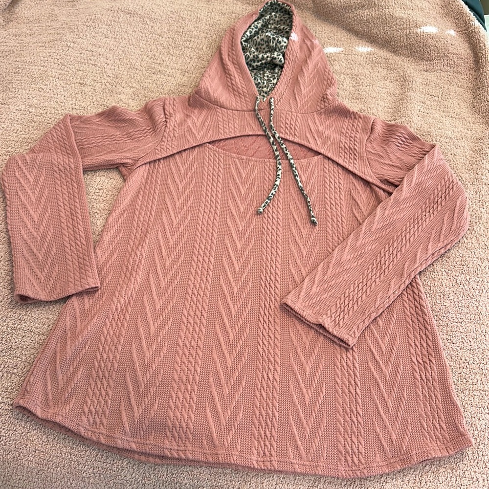 Long sleeve top with hood and peek a boo detail at neckline